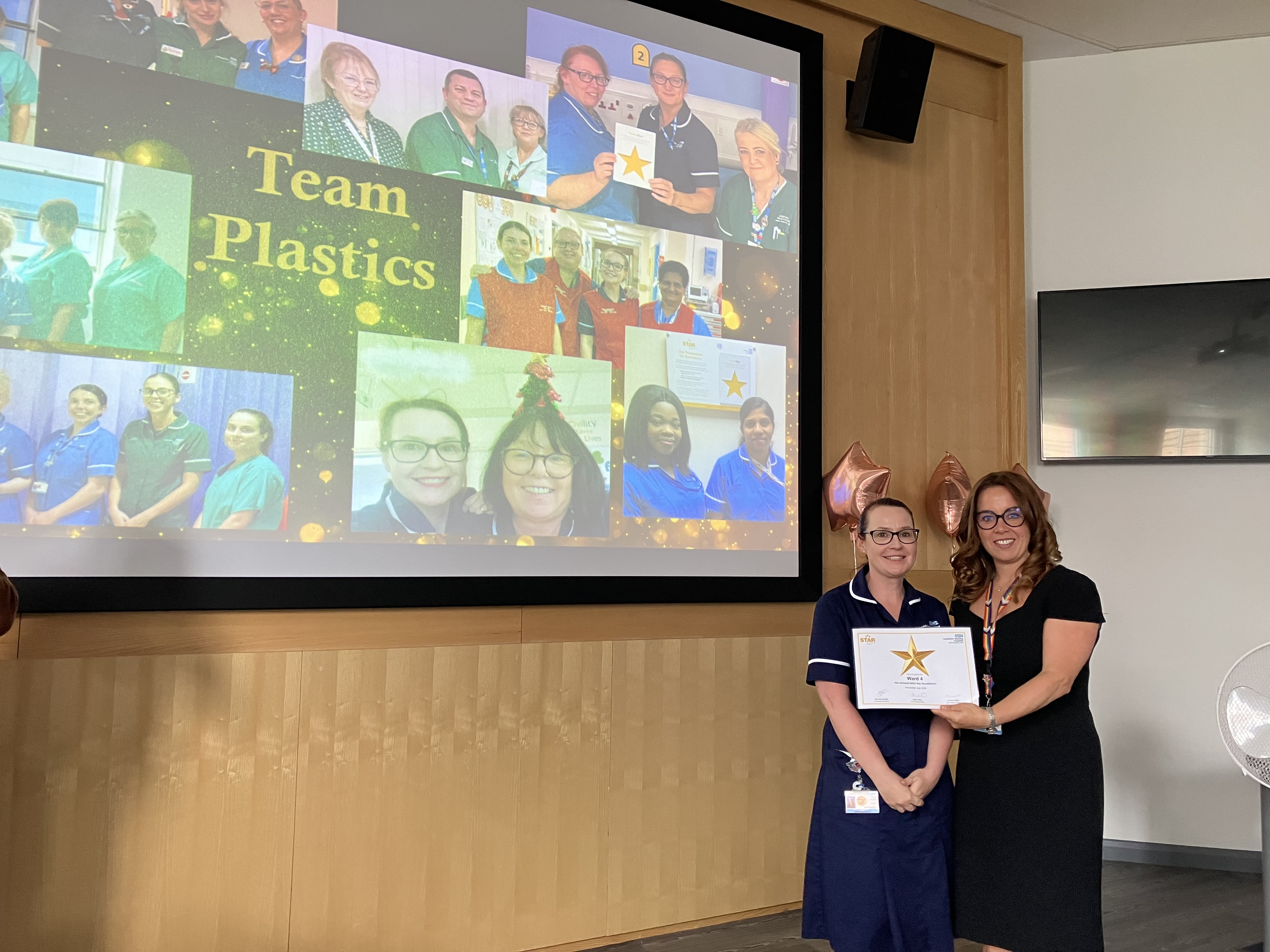 Group photo of staff members receiving award