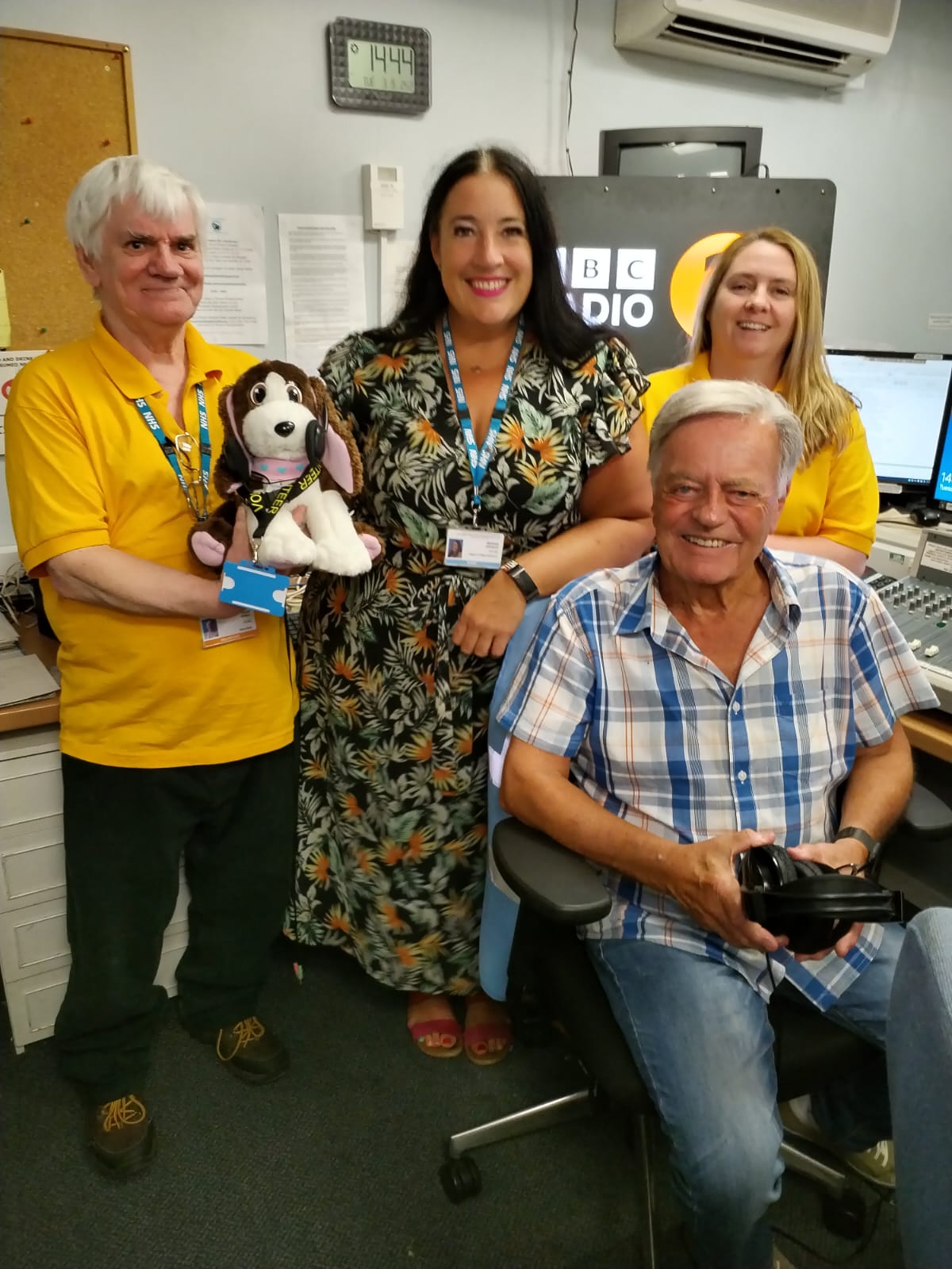 Steph, volunteers and Tony Blackburn group photo inside radio studio