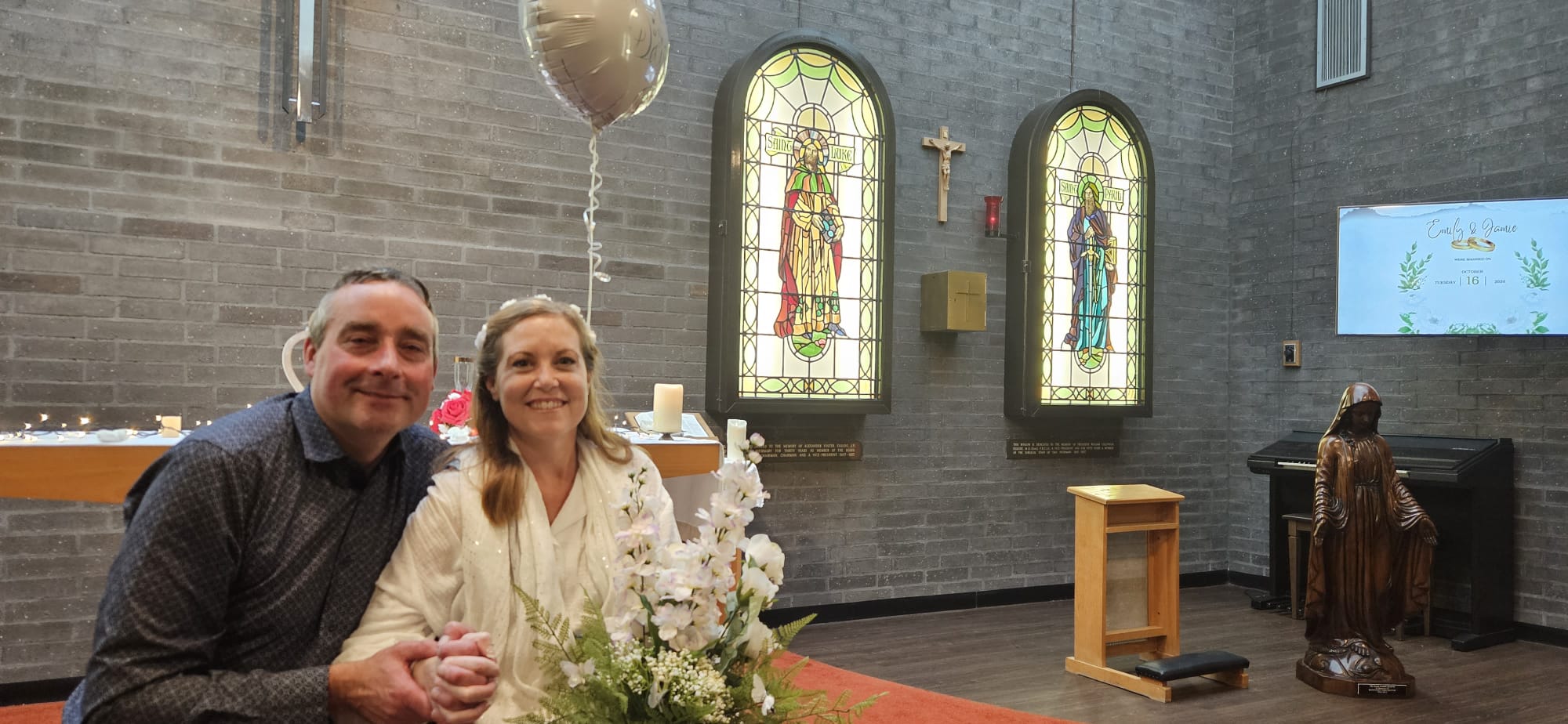 Photo of married couple inside religious chapel