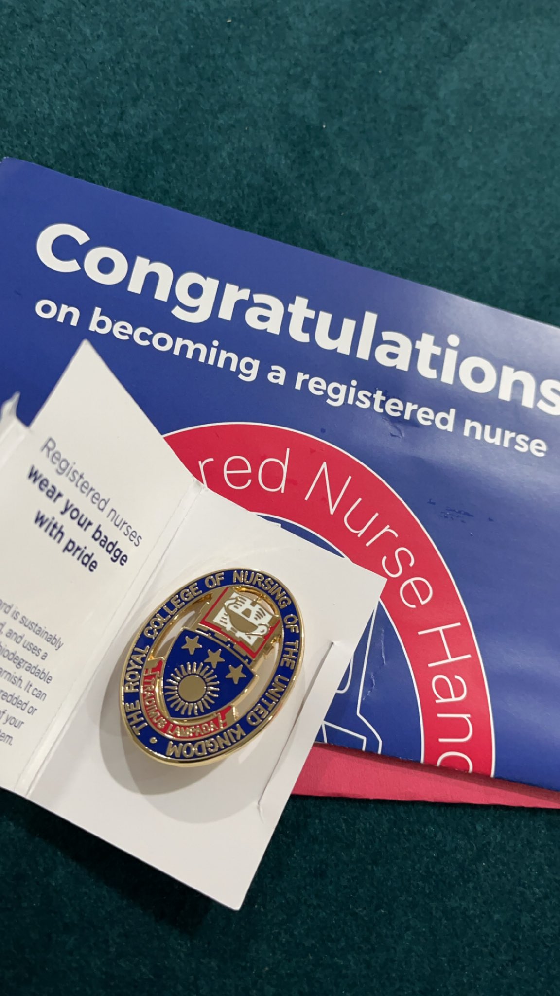 Photo of Zaib's badge for graduating and becoming a registered nurse