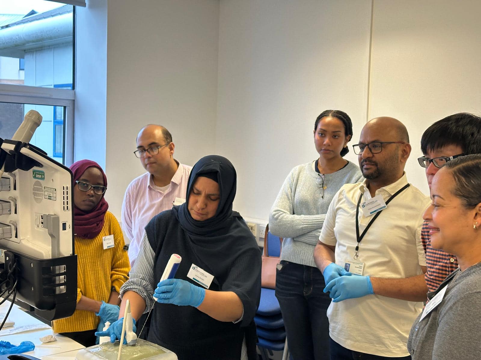 NHS professionals and trainees overseeing work being done