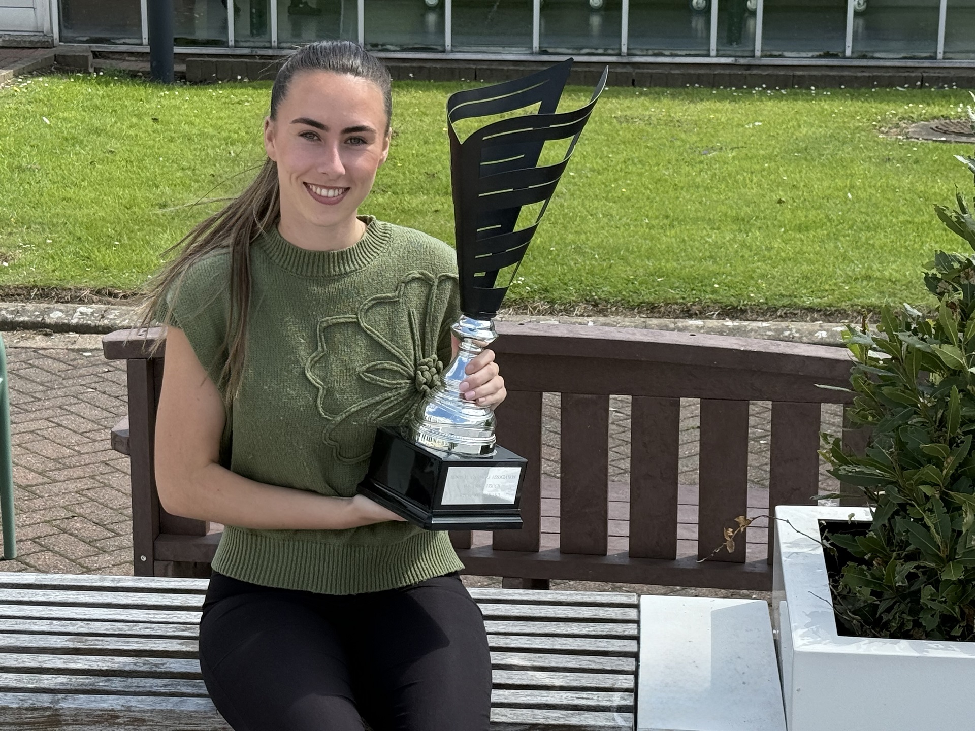 Photo of Layla holding her award